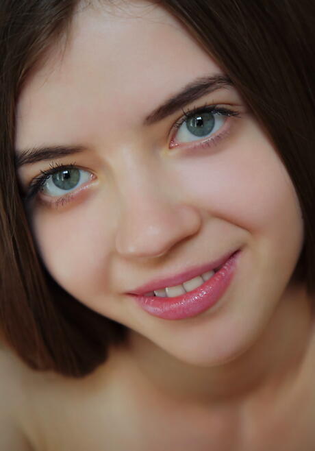 Sexy young Kay J baring big boobies and shaved pussy 